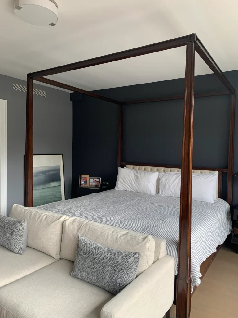 Bedroom with black painted feature wall