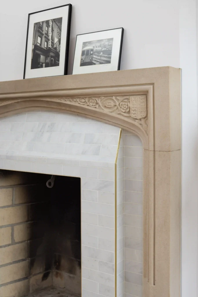 Original fireplace Retiled with marble brass touches and stone frame